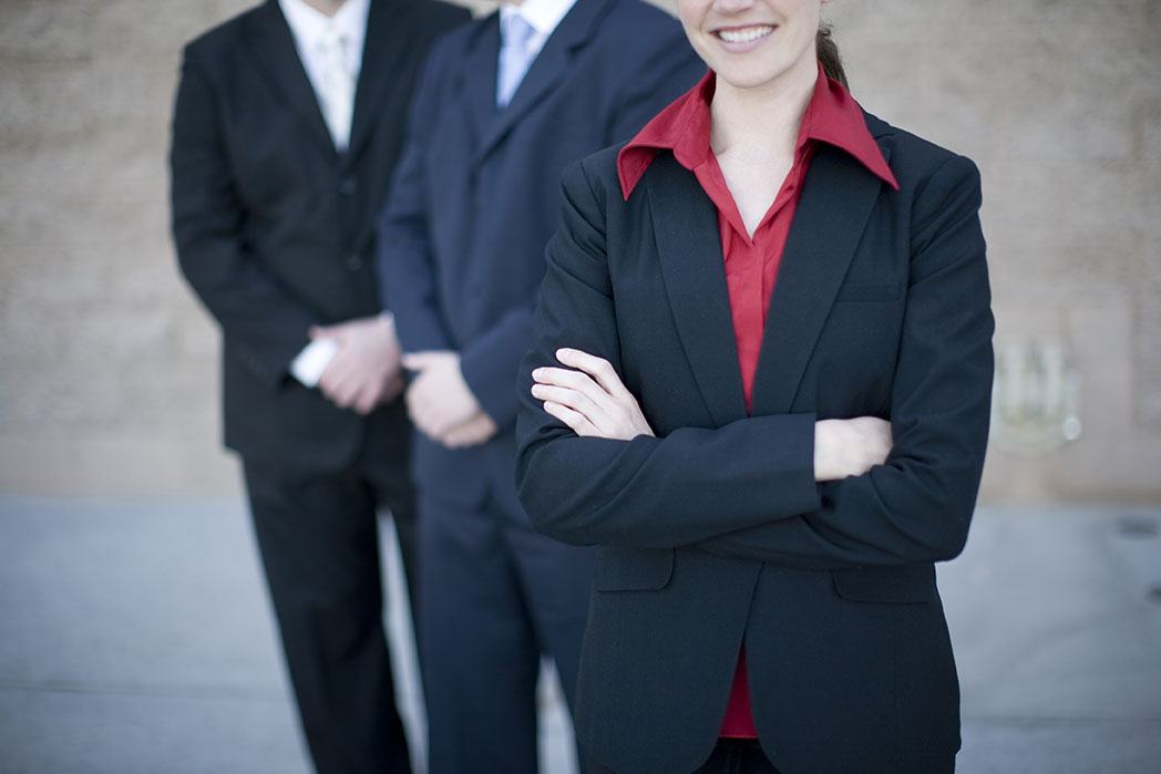 business people with arms crossed in front