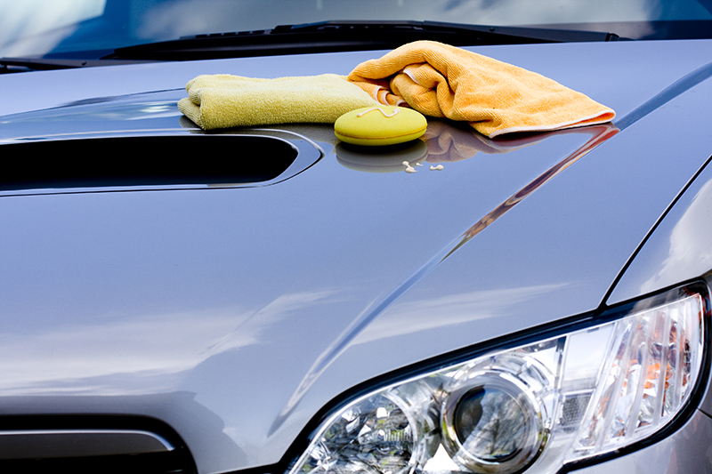 | Schaefer Autobody Centers rags sitting on hood of silver car