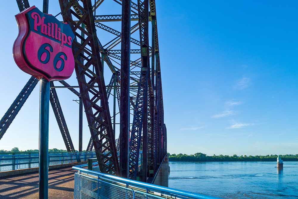 route 66 sign next to bridge over water