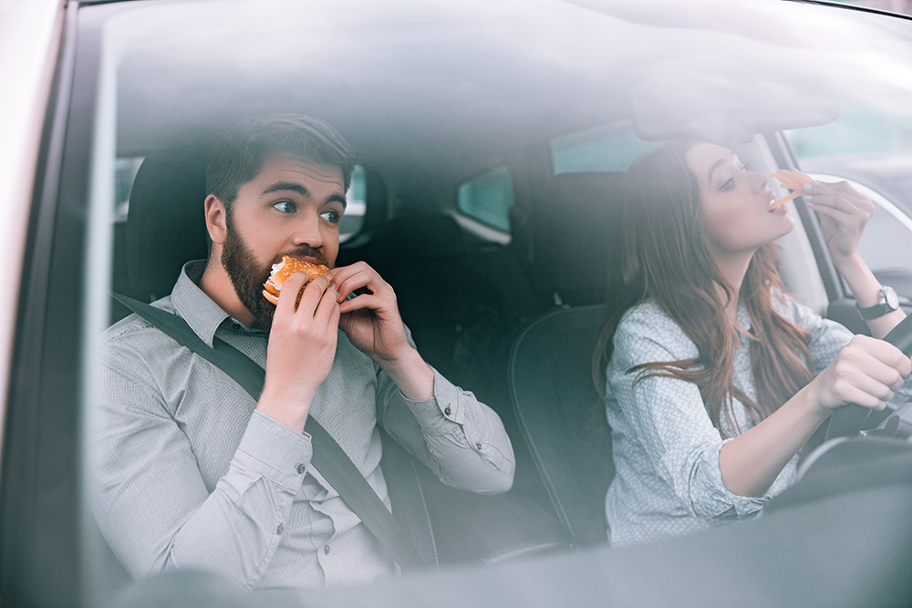 Couple eating in car