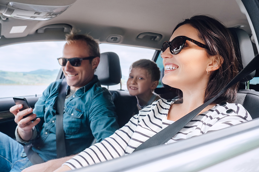 | Schaefer Autobody Centers Happy family riding in a car