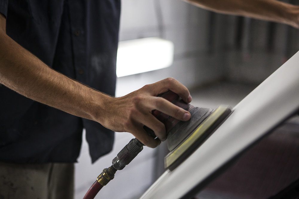 person buffing car