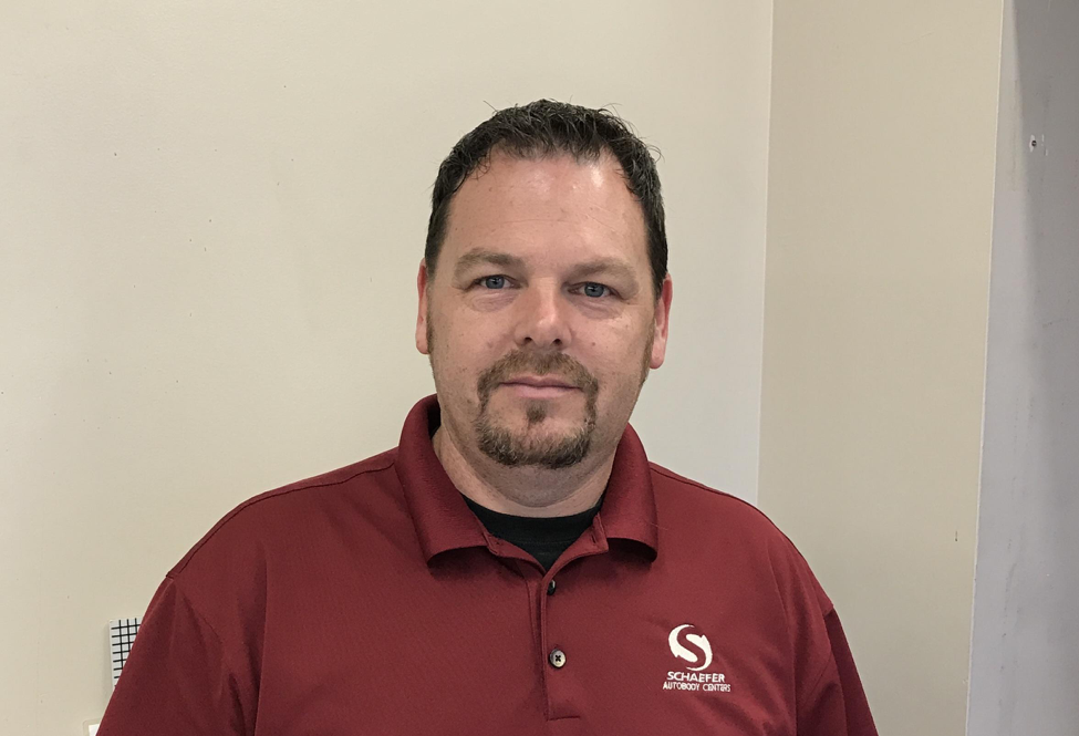 | Schaefer Autobody Centers bill smiling standing in front of white wall