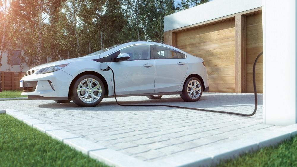 | Schaefer Autobody Centers electric car outside of house being charged
