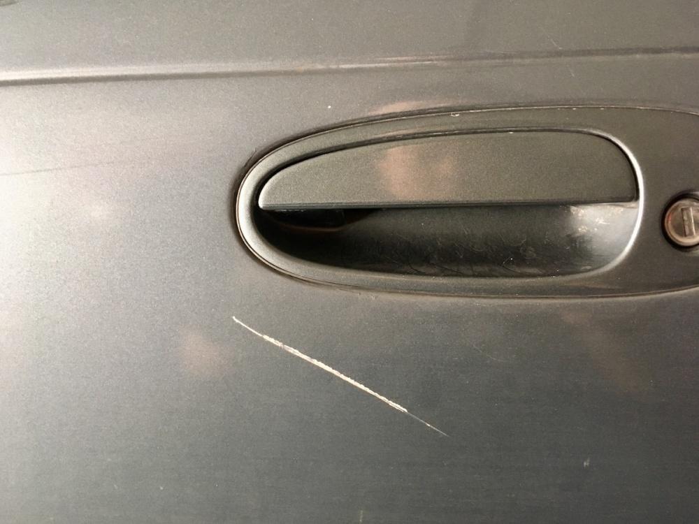 | Schaefer Autobody Centers Grazed Scratch on Car - The gray car is scratched by the crashes caused by the careless driving.