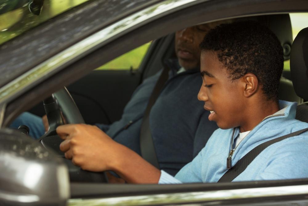 | Schaefer Autobody Centers Father teaching his son how to drive.