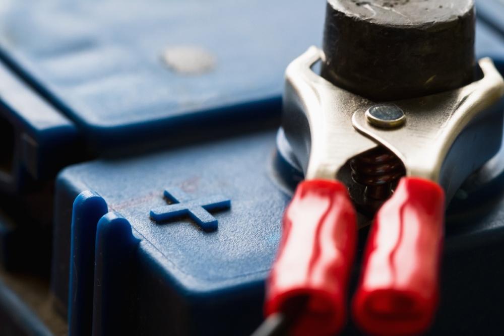 | Schaefer Autobody Centers Terminals plus of the old battery. Charging the car battery with an electric current.