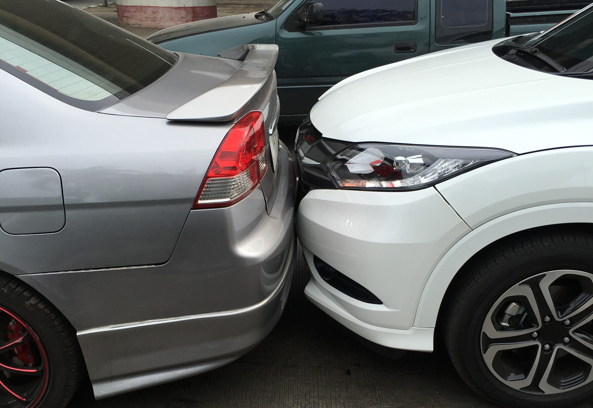 photo of car rear-ending another