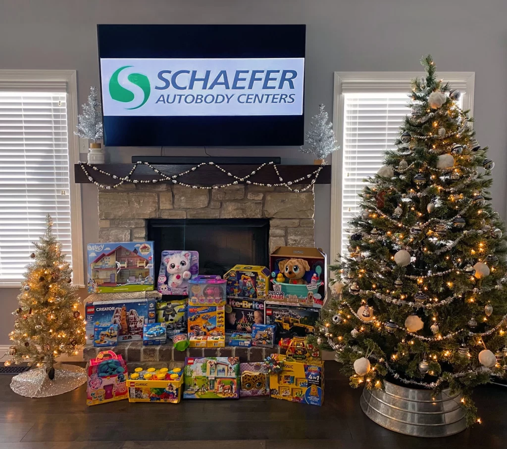 SFV6 | Schaefer Autobody Centers Toys collected in front of the fireplace