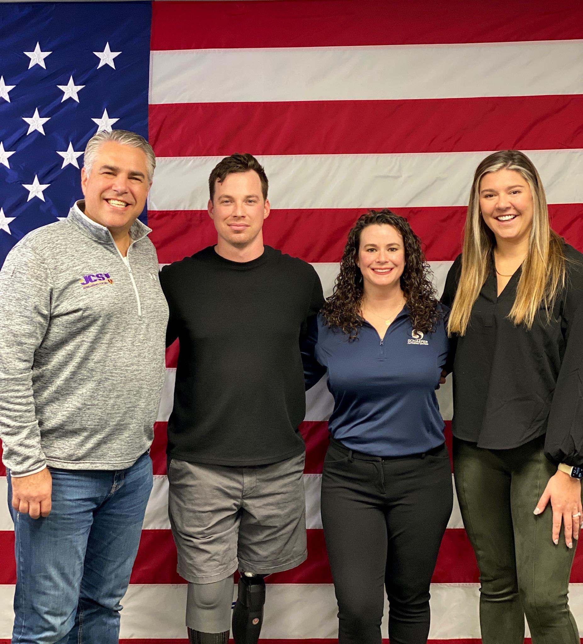 Veterans, members of JCS and a Schaefer Autobody employee post after their on-air segment. 