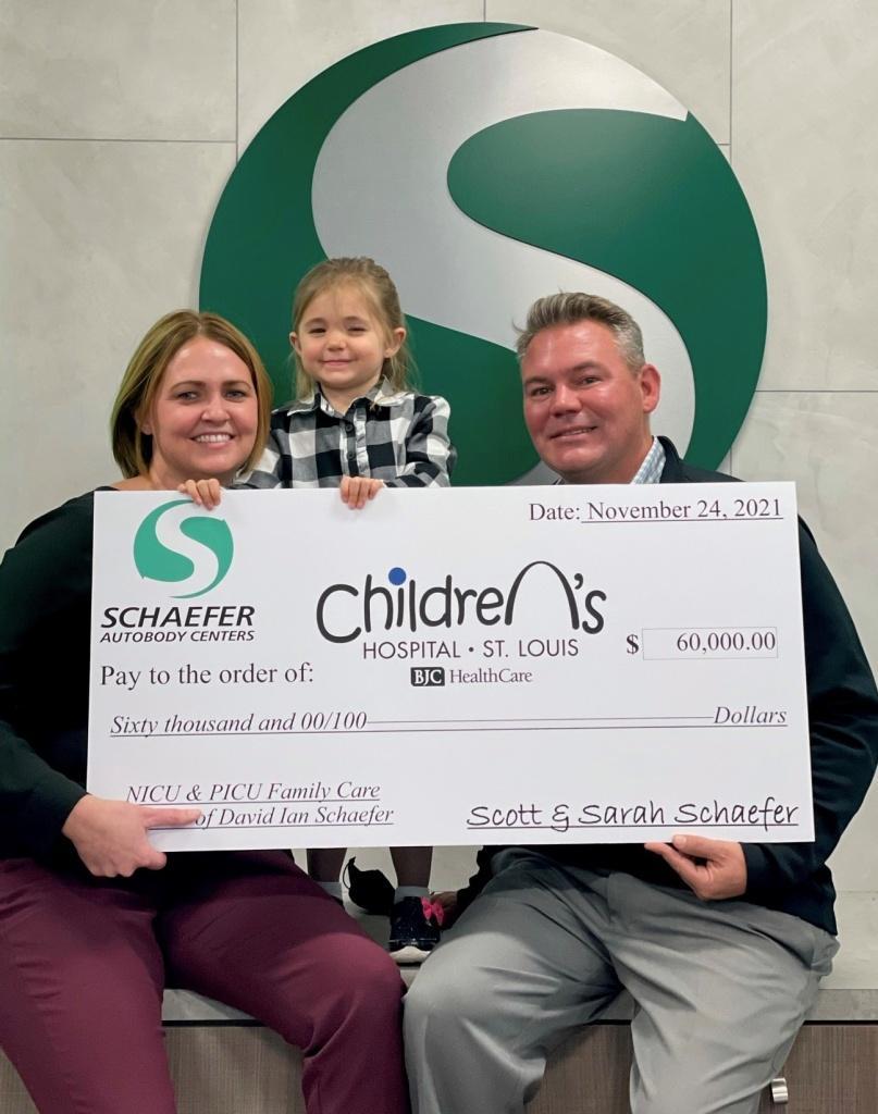 Scott, Sarah and daughter present check to St. Louis Children's Hospital