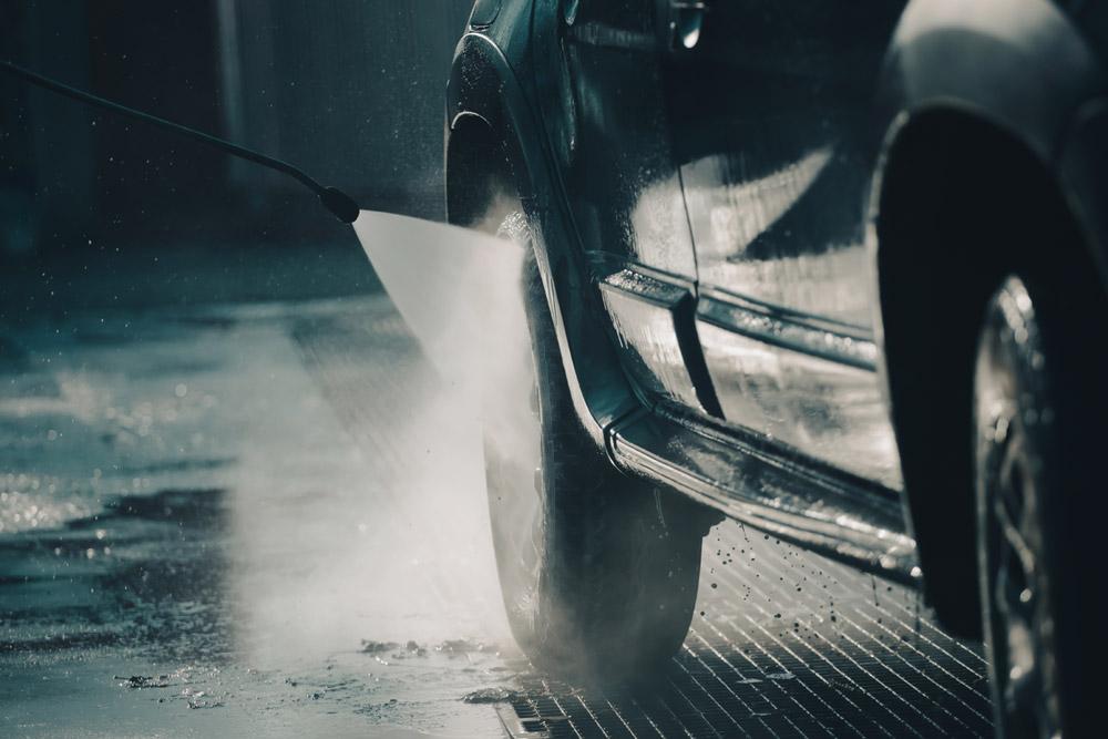 Dirty car being washed in winter