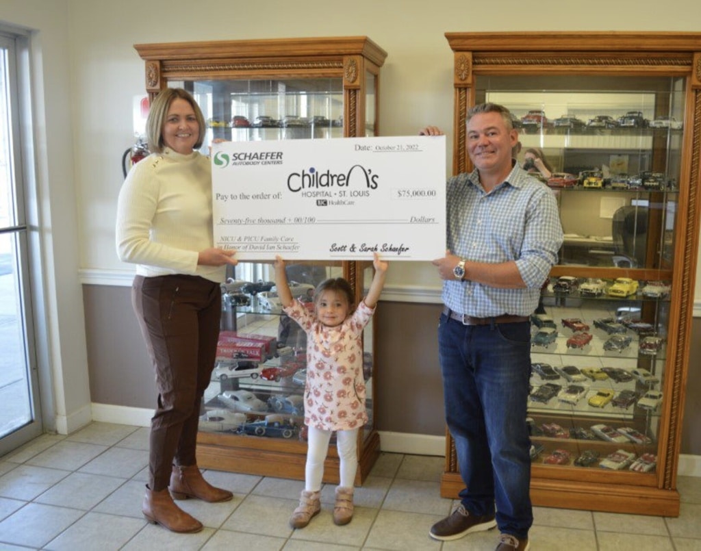 Scott, Sarah and Olivia Schaefer Presenting the donation check from funds raised at the Annual David Ian Golf Tournament benefitting St. Louis Children's Hospital. 
