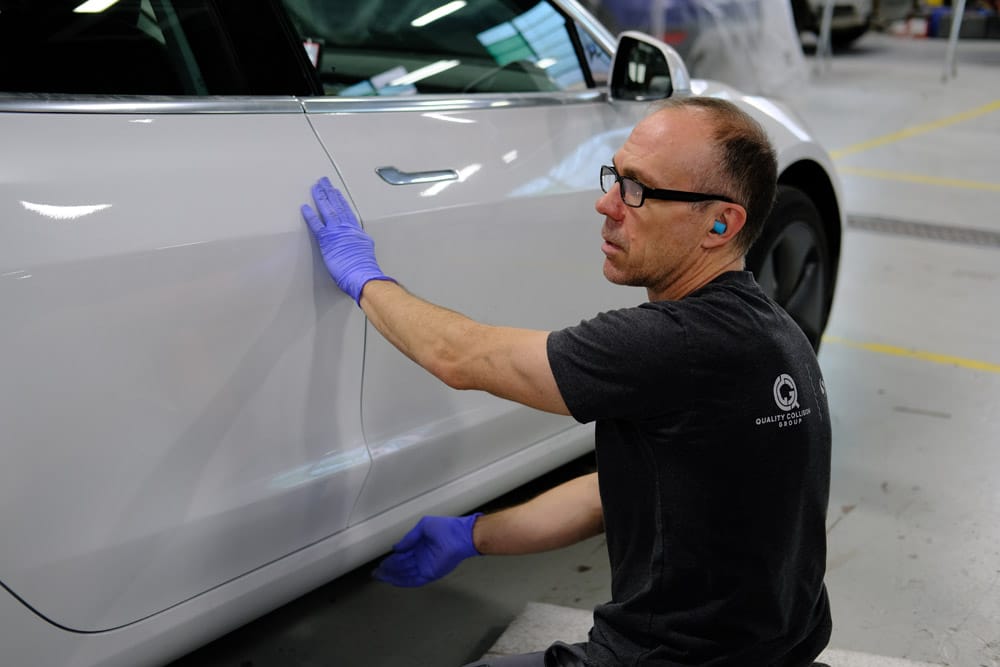 oem_vs_aftermarket | Schaefer Autobody Centers Charlie checks over an OEM panel